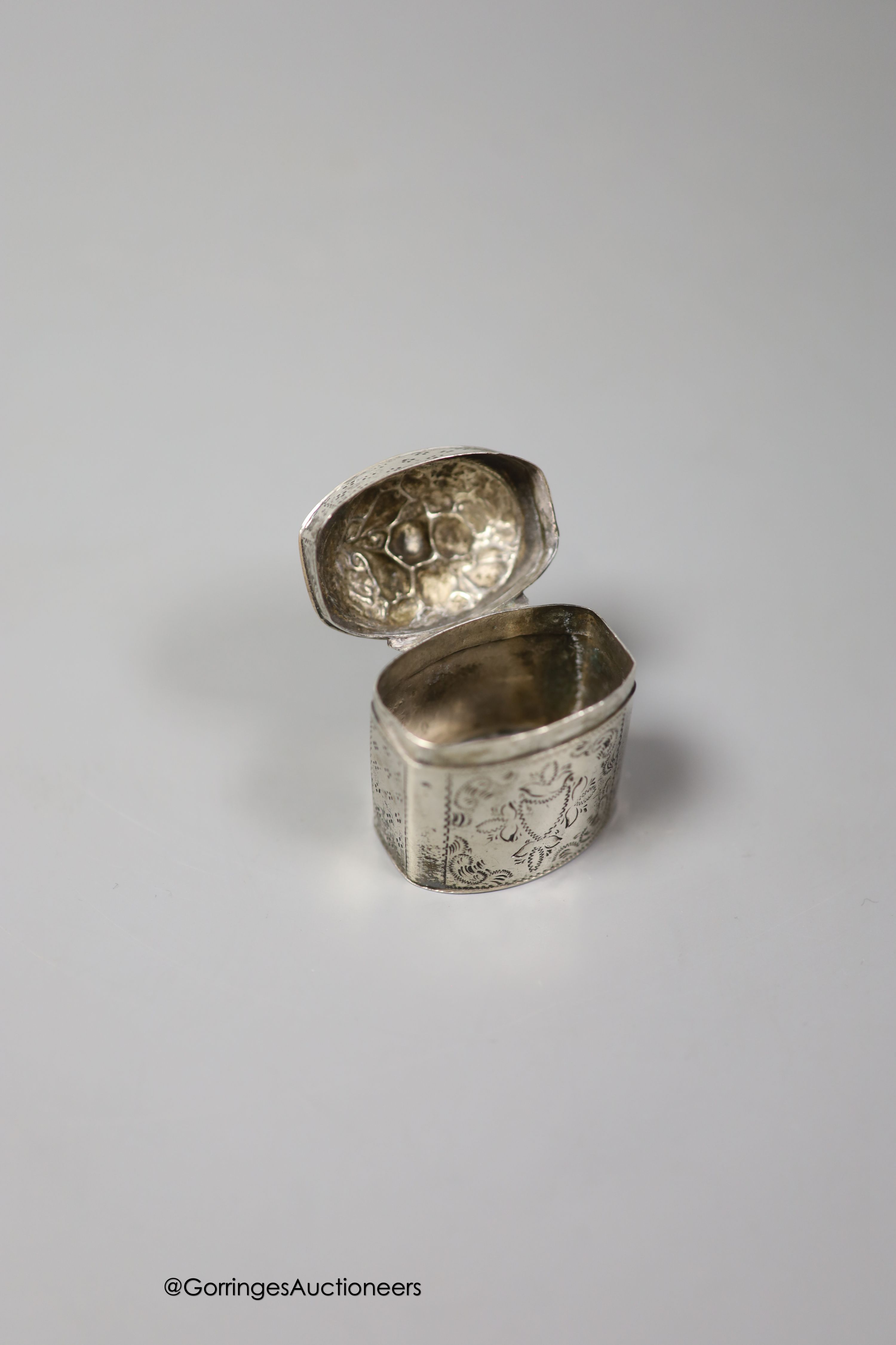A 19th century Dutch white metal pill box, 42mm and a base metal sovereign case.